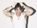 Discovery splash banner for Tom Grennan Discord server